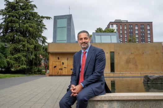 Eduardo sitting in front of St. Ignatius